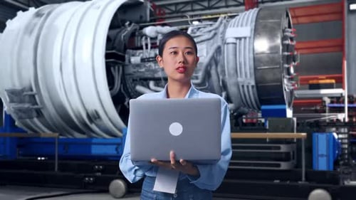 Asia Female Worker Use Laptop And Looking Around With Jet Engine