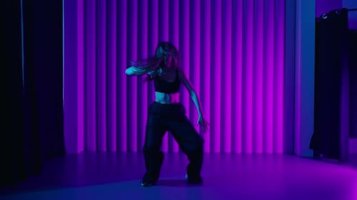 Beautiful Young Woman Dancing HipHop In Studio With Neon Lights Active And Energetic Dance