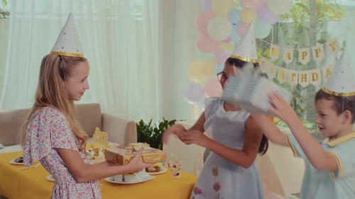 Kids Exchanging Gifts at a Birthday Party