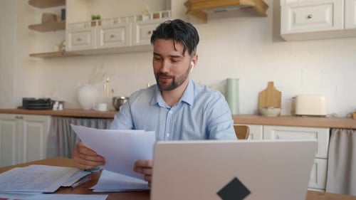 Man on Video Call at Kitchen Table