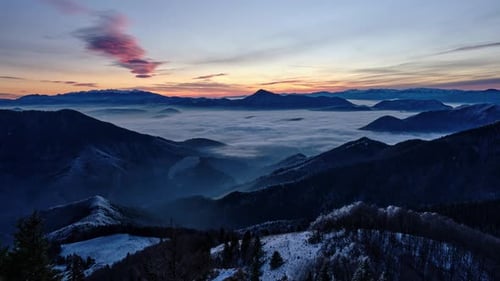 Epic Mountain Sunrise Timelapse Over Thick Clouds and Valley Fog in Winter
