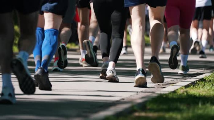 Marathon Runners Pacing Rhythmically on Park Pathway Demonstrating ...