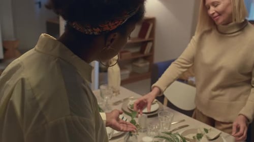 Family Prepares Table Setting for Dinner Together