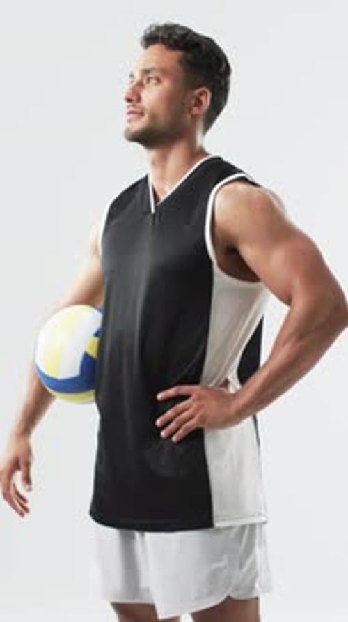 Muscular Young Adult Male Holding Volleyball