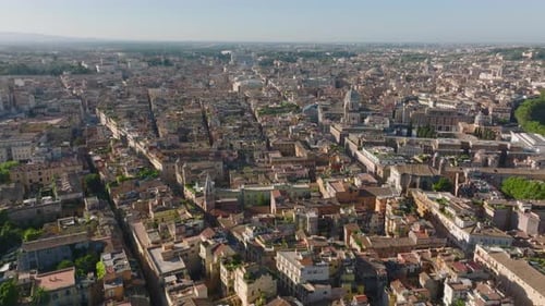 Backwards Fly Above Old Town Narrow Streets and Historic Buildings in City
