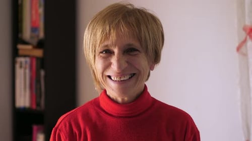 Smiling Senior Woman in Red Sweater Close-Up
