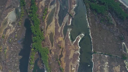 Nature on beautiful lagoon in Albania with colors and shapes like abstract painting seen from above
