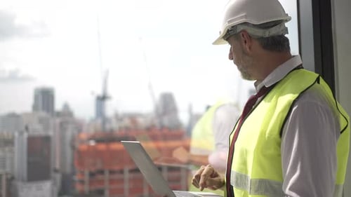 Engineers work in high rise building.