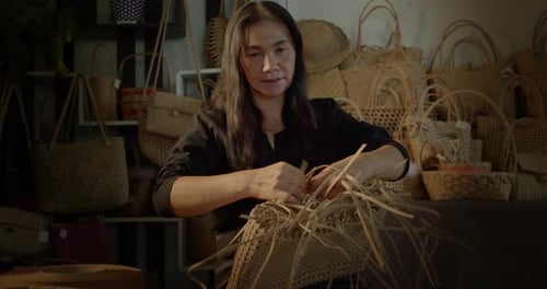 Woman Crafts Beautiful Woven Basket in Workshop