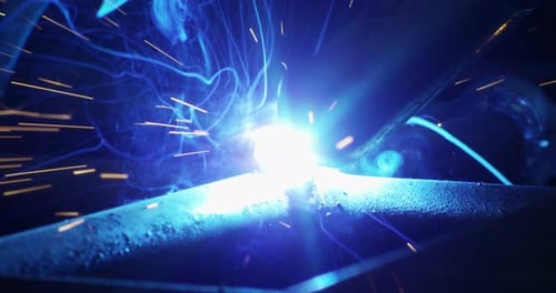 Close Up of Hot Blue Welding Sparks and Smoke