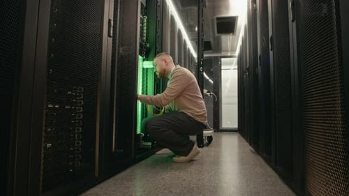 Technician Working on Servers in Data Center