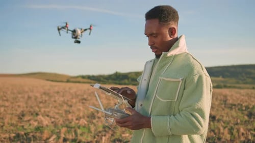 Professional Drone Operator Utilizing Advanced Technology in the Agricultural Field Landscape