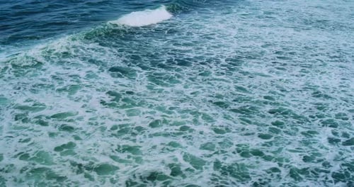 Drone Aerial Footage of Waves Flowing Across Tropical Beach
