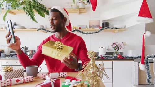 Man in Santa Hat Video Chatting at Christmas