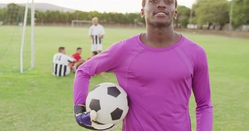 Video of african american football player on field with ball