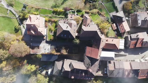 Aerial video over cloudy morning, medieval town of Gruyeres, Fribourg