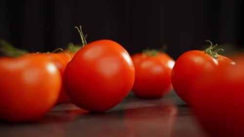 Fresh Red Tomatoes on Dark Background
