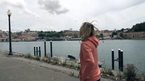 Young Woman Jogging in City and Taking Break 30s