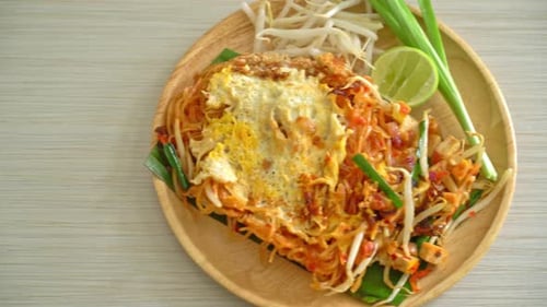 Pad Thai Noodles Served on Wood Plate