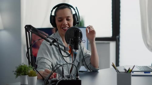 Creative Podcaster Hosting Internet Live Talk Show While Sitting in Studio