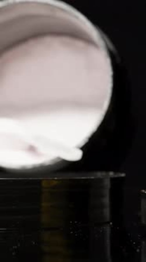 Protein Powder and Red Liquid in Containers