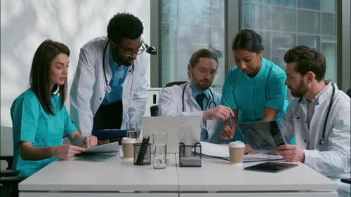 Medical Team Collaborating Around Conference Table