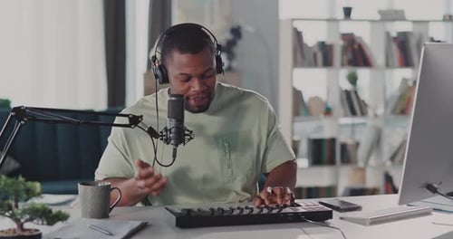 A Focused Individual Diligently Working on Their Computer and Keyboard in a Modern Home Office