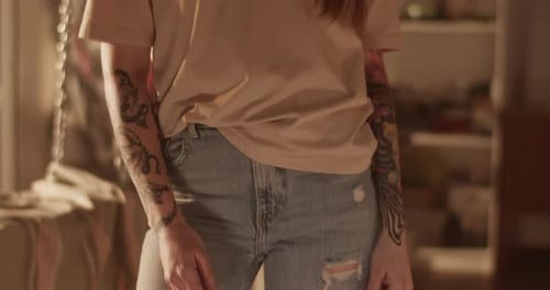 Stylish Woman Posing Indoors With Tattoos