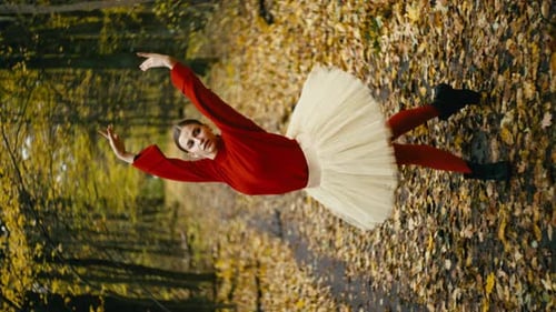 Female Dancer in Red Outfit Performs in Woods