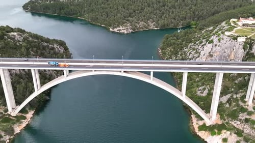Drone flight above a beautiful arch bridge near the town of Shibenik in Croatia
