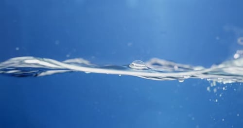 Water Surface Ripples Against Blue Background