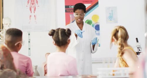 Enthusiastic Science Teacher with Attentive Elementary School Students