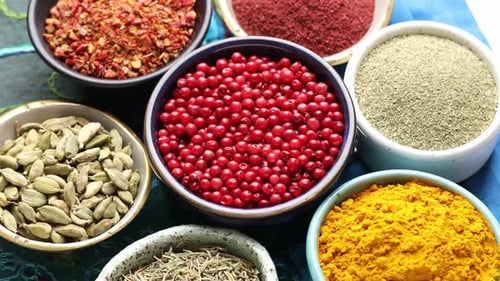 Colorful Assortment of Various Spices in Small Bowls