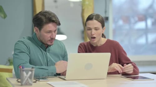 Creative People Discussing Work in Office