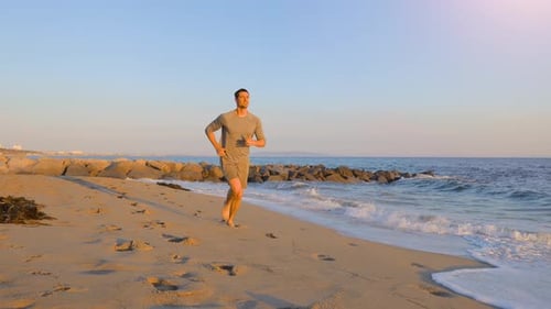 Athletic Man Exercising At The Beach