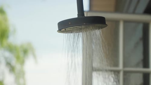 Refreshing Water Pouring from Outdoor Shower Head