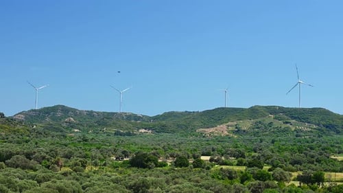 Windmill on a Hill Producing Renewable Energy From Wind
