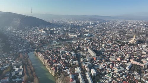 Aerial view of center of Tbilisi under Mtatsminda mountain, Georgia 2022