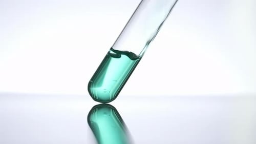 Turquoise Liquid Filling Glass Test Tube Close Up