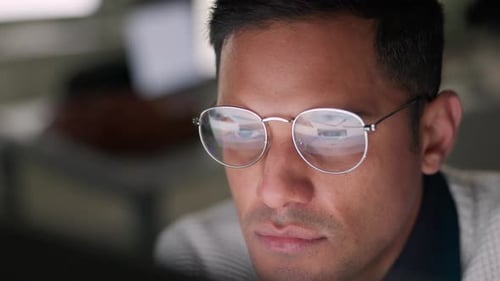 Young Adult Working on Computer in Office
