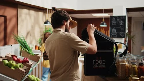 Deliveryman Picks Up Order From Bio Shop