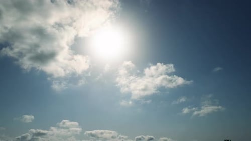 Clouds Moving Across a Blue Sky on Sunny Day