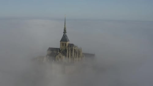 Aerial view of Mont Saint-Michel in fog, France.