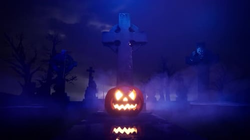 Jack-o-lantern in a cemetery on the eve of Halloween