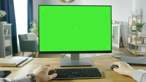 First Person View of Professional Freelancer Working on Green Mockup Screen Personal Computer From