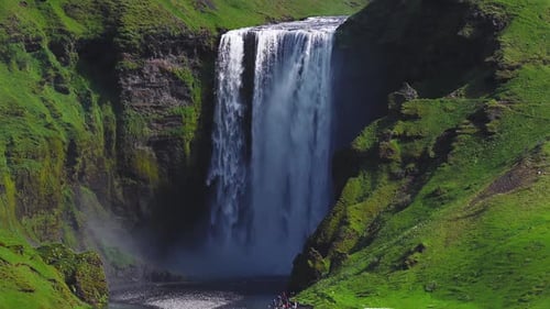 Aerial View of Skogafoss Waterfall Cascading Over a Steep Cliff