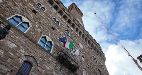 Static Nadir View of Palazzo Vecchio Facade with Flags in Florence
