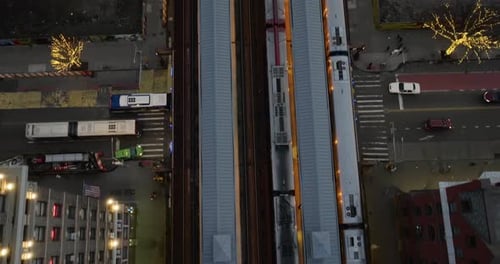 Aerial view above trains at the 125th Street railway station, gloomy evening in Harlem, NY, USA - to