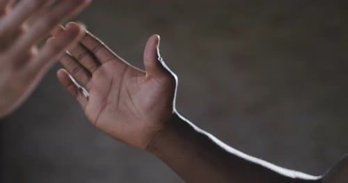 Two Hands Clasping Together in Agreement