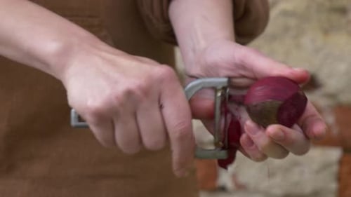 Peeling a Red Beet with a Peeler